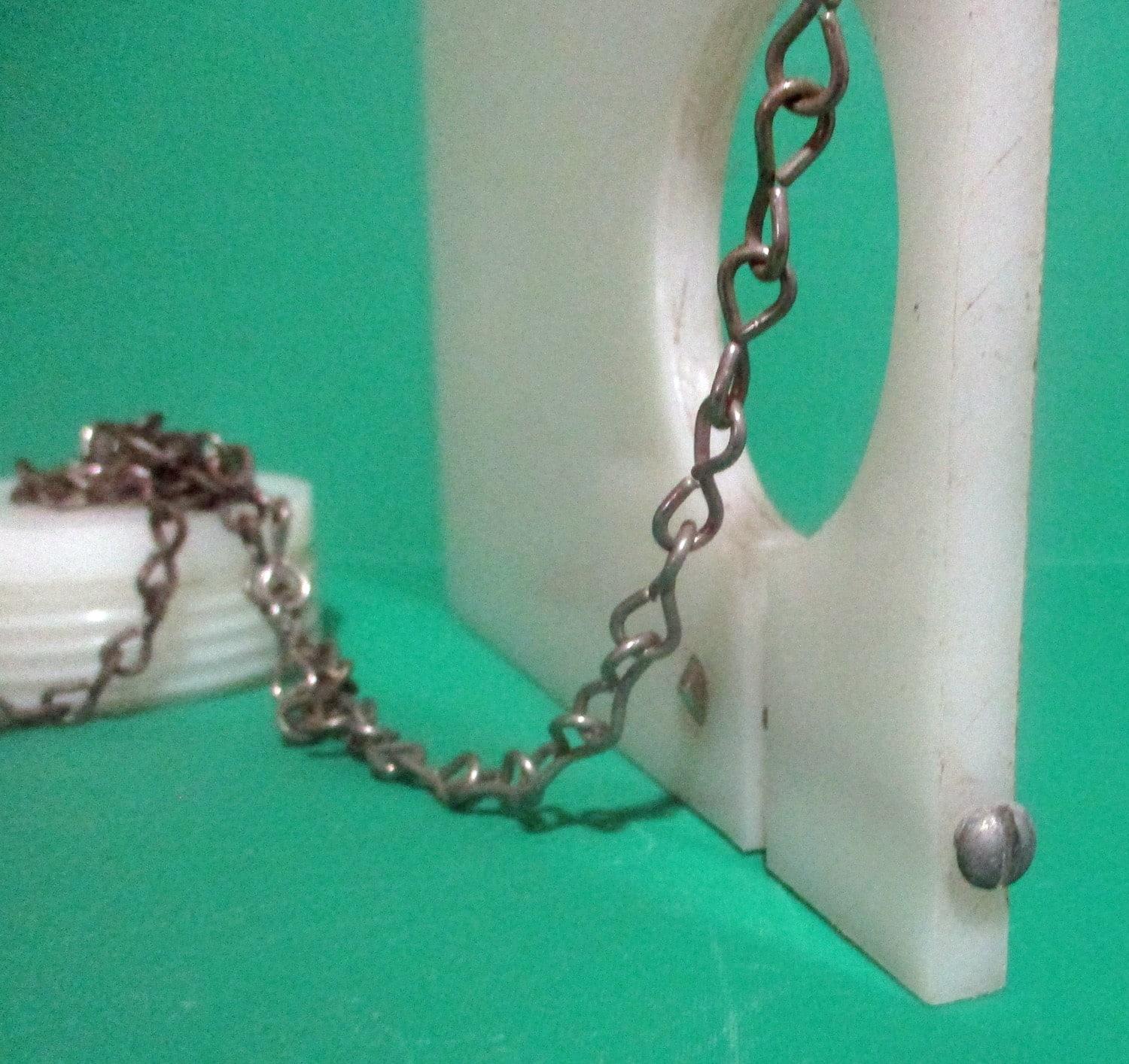 Bracket, Sanitary w/Two 1 1/2" Plugs w/Chains 4 close up