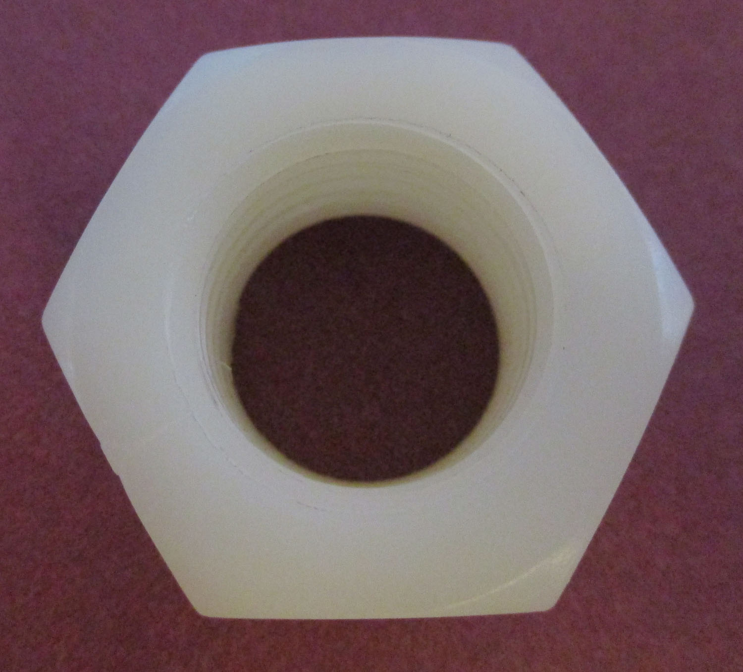Nut, Mueller-Matic, White, 11/16"ID 4 Nut Mueller-Matic White 11/16"ID