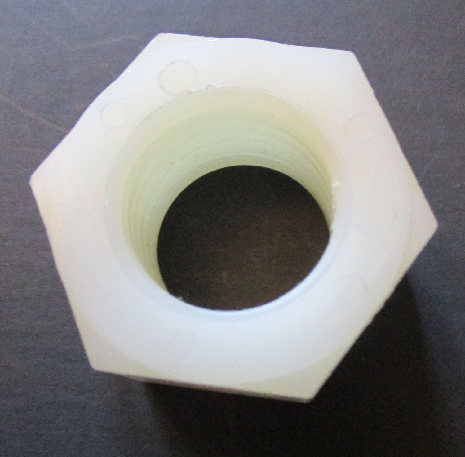 Nut, Mueller-Matic, White, 11/16"ID 7 Nut Mueller-Matic White 11/16"ID